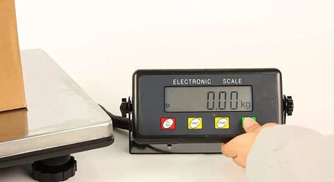 Heavy Duty Digital Postal Scale With Adjustable Viewing Head And Fold Away Handle Locks In Your Shipping Game Smooth Operator showing 0.00 kg on display.