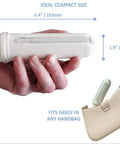 Hand holding Portable Travel Bidet with Dual Pressure Options, 6.4 inch size, shown with handbag for scale.