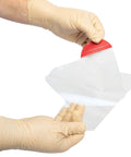 North American Rescue HyFin Vent Chest Seal twin pack; transparent seal with red pull tab opened by gloved hands.