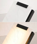 Tipace Hardwired Modern Black LED Wall Sconce Indoor Wall Light Fixture with white marble panel and black accents.