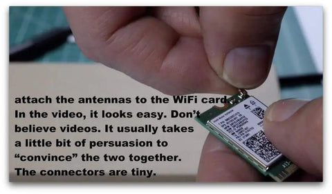 Person connecting Dual Band WiFi Antenna 2.4GHz And 5GHz High Gain 10dBi RP SMA Male Cable to WiFi card.
