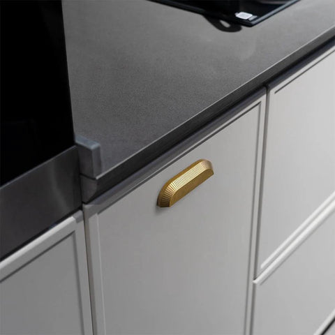 Six Pack 5 Inch Antique Brass Half Moon Cabinet Cup Handles installed on kitchen cabinet