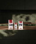Milk Pipework Cleaner For Coffee Machines, 100 Sachets, boxes displayed on a wooden shelf with a dark background