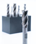 Six-piece set of 4-flute center-cut end mills (1/8–1/2 in) with 3/8 in shank and plastic stand