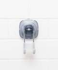 Clear suction shower hook with silicone grip on white tile for loofahs, towels, razors. No drill strong suction cups for smooth glass.