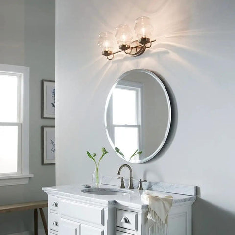 Janiel 24 Inch Three Light Vanity Light With Clear Glass Shades In Classic Bronze Finish For Above The Mirror