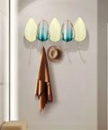 Heavy Duty Iron Wall Mounted Coat Hooks And Scarf Organizer With Sleek Geometric Lines, featuring a brown scarf and hat.