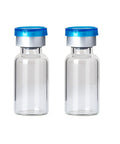 Front view: two 10ml clear glass vials with blue aluminum flip-off caps.