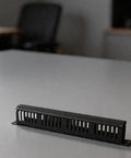 Rock Solid 24 Port Network Patch Panel For 19 Inch Rack Mount With Standard Rj45 Jacks Heavy Duty Cable Management Gear Total Wire Wrangler For Server Rooms And It Closets Black Finish on a table.