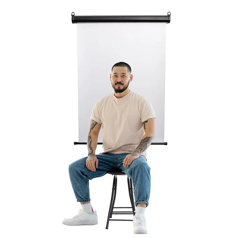 Retractable White Photo ID Backdrop For Passport Photos, Wall Or Ceiling Mount, 36 Inch Wide Screen, person sitting in front