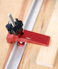 Rock Solid Aluminum T Track Hold Down Clamps For Woodworking And Metalworking Projects Plus Quick Slide In T Slot Press Clamps showing a red hold down clamp adjusting on wood.