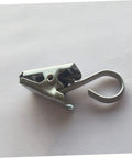 Close-up of single stainless steel curtain clip hook for the "Stainless Steel Curtain Clips Hooks 30 Piece Set For Easy Hanging Of Draperies Durable Heavy Duty Design For Home And Office Use Rustproof And Smooth Glide."