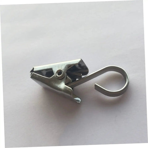 Close-up of single stainless steel curtain clip hook for the "Stainless Steel Curtain Clips Hooks 30 Piece Set For Easy Hanging Of Draperies Durable Heavy Duty Design For Home And Office Use Rustproof And Smooth Glide."