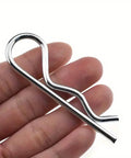 Close-up of a single M3 5x75mm white zinc-plated spring hitch cotter pin, part of 10 Pack Spring Hitch Cotter Hair Pins And White Zinc Plated Retaining Wire Clips For Trailers And Equipment, Cast Iron Pull Ring And Positioning Pin, Size M3 5x75mm, Rust Resistant, Built Tough, Reusable
