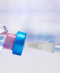 Prime Condition 100 Pack 27 Gauge Half Inch Syringe Needles with Reliable Luer Lock Tips connecting to a vial.