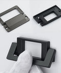 Edge Finger Pulls 2 Pack Concealed Cabinet Handles for Drawers and Cupboards, Zinc alloy knob pulls in hand and on surface.