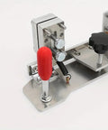 Top Shelf Heavy Duty Belt Grinder Knife Jig With Ridiculously Precise Angle Guides And Built Tough Stainless Steel Base close-up of adjustment knobs and metal clamps.