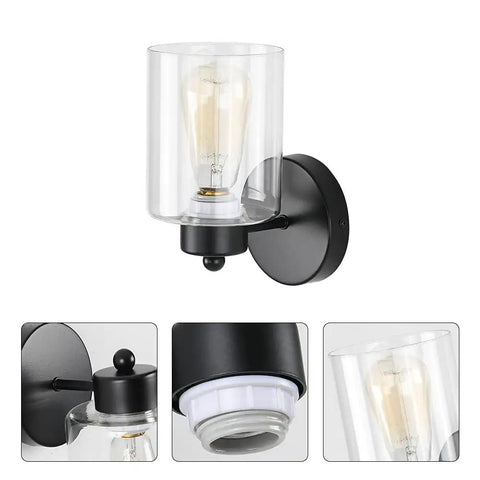 One Light Matte Black Bathroom Vanity Sconce With Clear Glass Shade showing metal base and light bulb details
