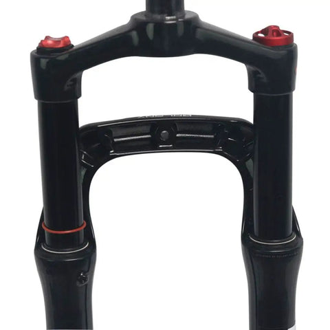 Close-up of Snow Mountain Bike Front Suspension Fork 26 Inch Pneumatic Shock Absorbers with Rebound Adjustment. Magnesium Alloy.