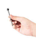 Hand holding a Straight Shooting Precision Forstner Bit from the 16 Piece Pro Drill Kit for woodworking and carpentry.
