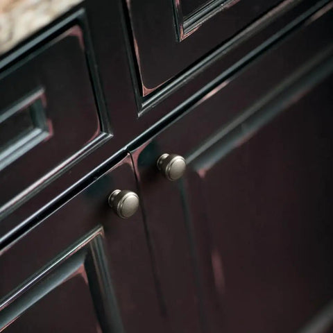Antique Silver Round Cabinet Knobs Six Pack on dark cabinetry, highlighting durable zinc alloy and smooth classic round design