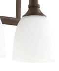 Close-up of Three Light Bathroom Vanity Light In Oiled Bronze With Clear Seeded Glass From The Richmond Collection Modern Transitional
