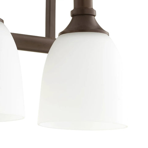 Close-up of Three Light Bathroom Vanity Light In Oiled Bronze With Clear Seeded Glass From The Richmond Collection Modern Transitional