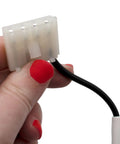 Hand holding connector of Model Specific Refrigerator Ice Maker Assembly Replacement 120V 8 Cube With Harness And Bail Arm Extension