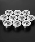 10 Pack stainless steel ball transfer bearings With Universal Swivel Caster Rollers on black surface, showcasing smooth design.