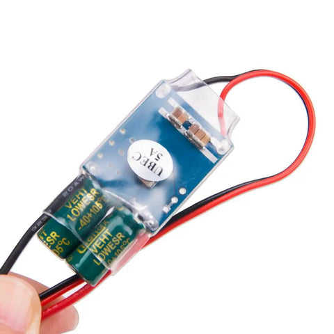 Close-up of Two Pack UBEC 5V 5A External BEC Voltage Regulator showing circuit board with wires for RC servos, FPV quadcopters, and airplanes.