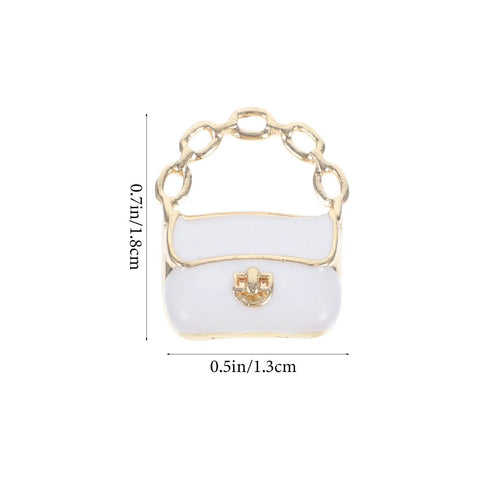 White miniature purse with chain handle, part of the Three Pack Mini Handbag Set for Dollhouse Decor, Lightweight Alloy and PP Tiny Purses.