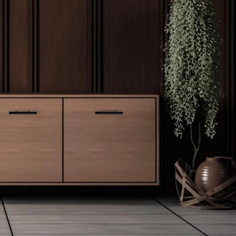 Set Of 30 Matte Black Cabinet Pulls, 5 Inch Length, 3 Inch Hole Centers, shown on wooden cabinet drawer
