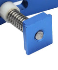 Close-up of Super Cool Anu Limen T Track Clamp In Vivid Blue showcasing the spring mechanism and square plate for secure hold downs.