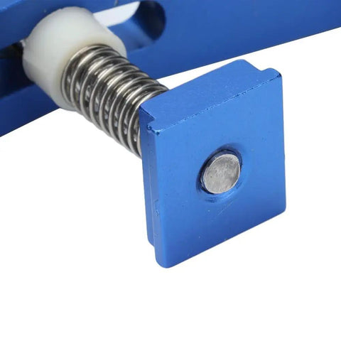 Close-up of Super Cool Anu Limen T Track Clamp In Vivid Blue showcasing the spring mechanism and square plate for secure hold downs.