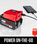 PWR CORE 20 Brushless 20V 4 And A Half Inch Angle Grinder Kit With 5.0Ah Battery and PWRAssist USB Adapter charging a smartphone