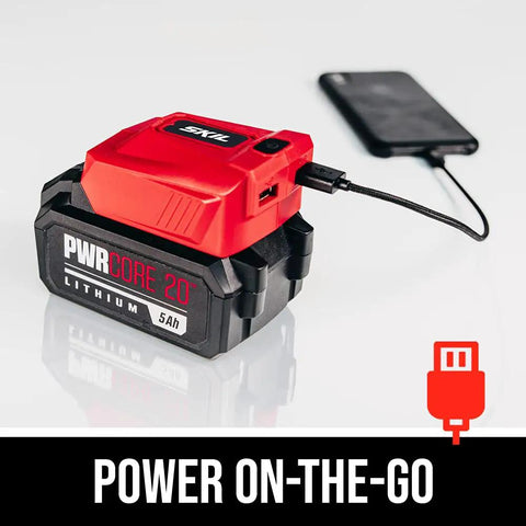 PWR CORE 20 Brushless 20V 4 And A Half Inch Angle Grinder Kit With 5.0Ah Battery and PWRAssist USB Adapter charging a smartphone