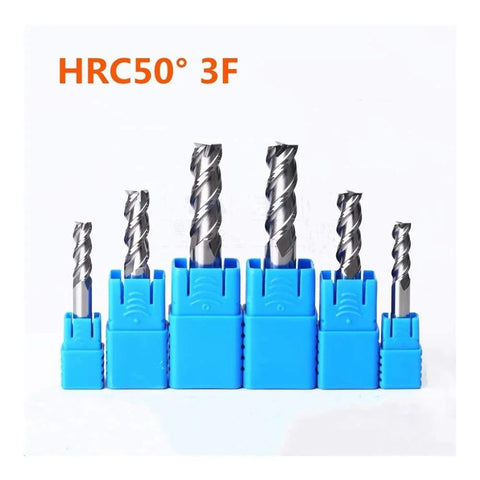 Carbide end mills set in blue plastic holders; seven spiral-flute cutters of varying diameters.