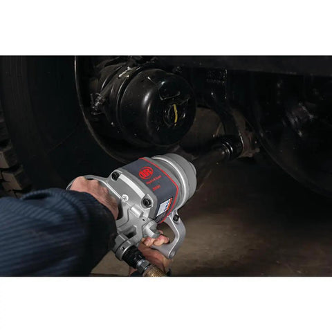 Pro Level One Inch Drive Air Impact Wrench in use, showcasing solid steel core for heavy garage tasks.