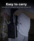 Person holding Mini Lever Chain Hoist 1100Lbs 0.5T With 10 Ft Lift Aluminum Alloy with storage bag, emphasizing portability.
