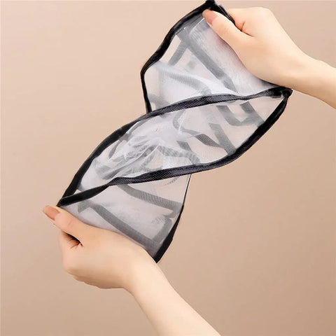 Hands holding a flexible nylon mesh divider from the Slick Nylon Mesh Drawer Divider Set For Bras Socks And Lingerie Dresser Sorting Bins That Keep Your Nightstand Squared Away Without Any Daily Fuss Or Clutter.
