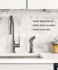 Universal Kitchen Sink Sprayer Replacement With Hose And Holder in brushed nickel on white marble backsplash by sink