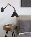 Badass Industrial Swing Arm Wall Sconce Adjustable Metal Light Fixture E27 Socket for bedroom beside bed with gray accents.