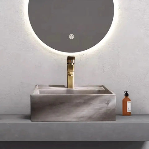 UMJIGF Vessel Sink Small Apartment Above Counter Basin Concrete Wash Basin on a modern countertop with a golden faucet.