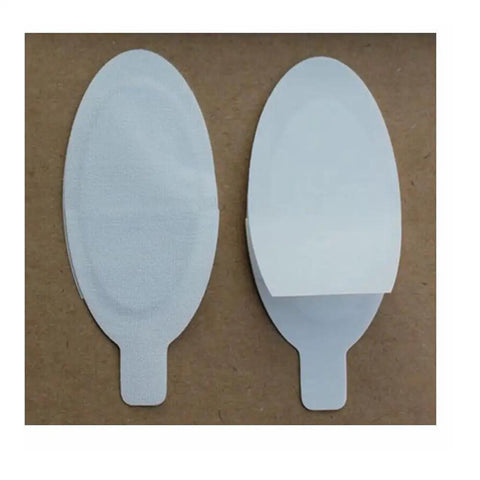 Secure Your Peepers With Confidence Using 100 Pairs Of Disposable Laser Eye Shields Perfect For IPL LED And Microdermabrasion Work Providing A Gentle Adhesive Seal That Folds Around Eyes For Maximum Security And Client Satisfaction, showing two eye shields.