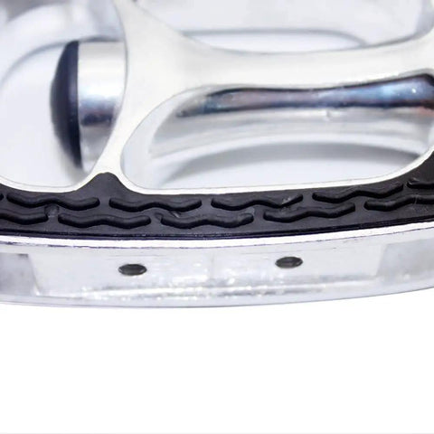 Close-up of Nine Sixteenth Inch Bicycle Pedals With Adjustable Toe Clips And Straps showing silver metal frame and anti-slip grip