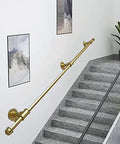 Hella Sturdy Gold Wrought Iron Handrail For Elderly And Kids Safety Stair Railing along a stairway with modern decor.