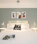 Modern bedroom with abstract art above bed, using Dope No Damage Picture Hanging Kit With 68 Invisible Nails For Concrete Walls.