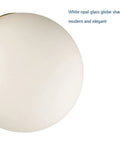 Close-up of white opal glass globe from A Retro Chic Mid Century Modern Globe Sputnik Ceiling Light Fixture 3 Light White Opal Glass With Brass Gold Finish Semi Flush Mount For Living Room Dining Room And Bedroom