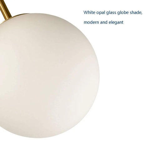 Close-up of white opal glass globe from A Retro Chic Mid Century Modern Globe Sputnik Ceiling Light Fixture 3 Light White Opal Glass With Brass Gold Finish Semi Flush Mount For Living Room Dining Room And Bedroom