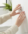 No Drill Wall Hooks Heavy Duty Adhesive Hangers For Kitchen Bathroom And Home Damage-Free Picture Hanging Hardware With Removable Non-Marking Tape 10 Pack installed on white wall